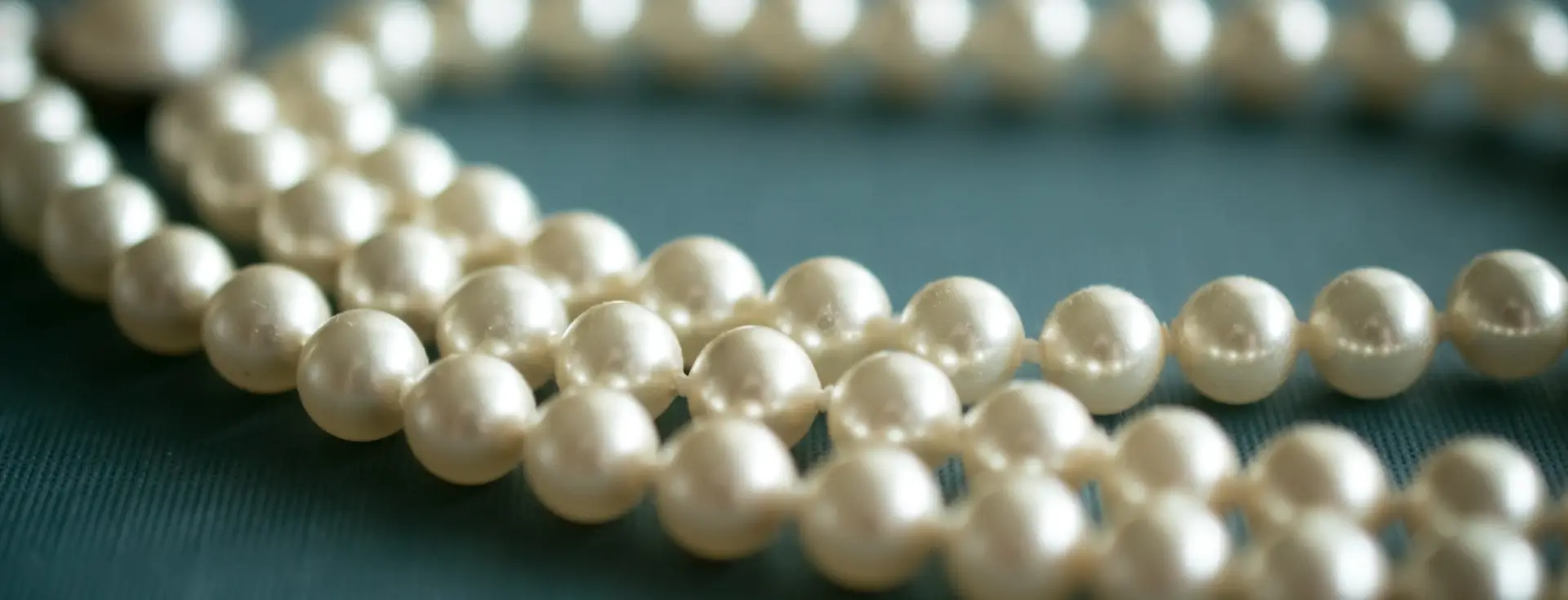 photograph-of-cream-pearls-strands-curved